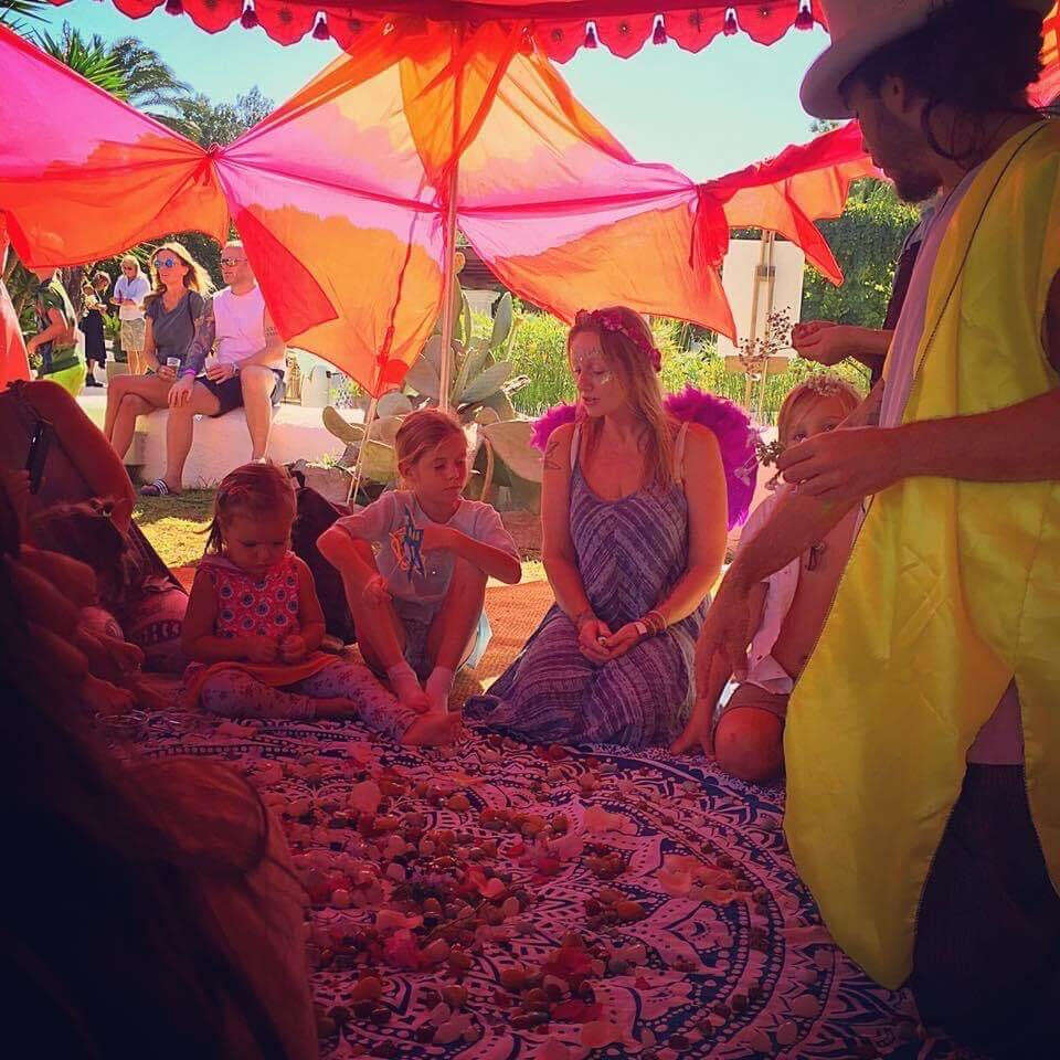 This is a photo of Jade Marsh teaching children about crystals in Ibiza Rock Club.